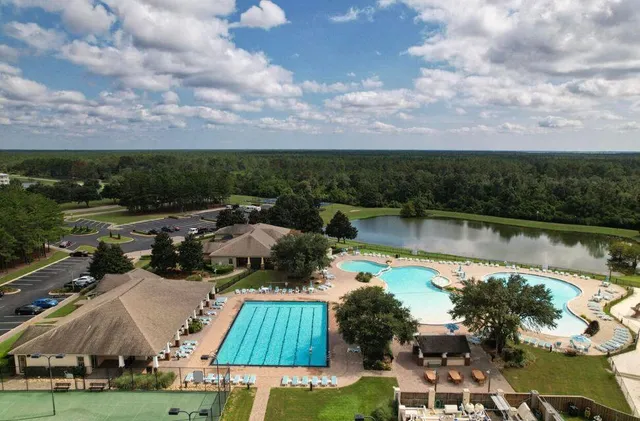 an aerial view of a house with a swimming pool