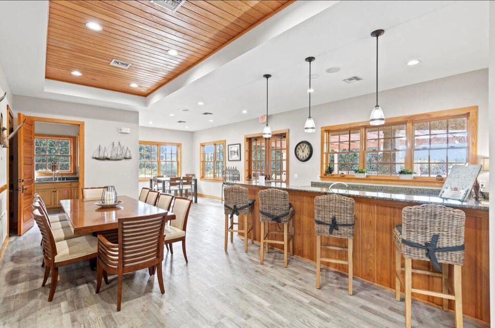 334 This Way Freeport, FL 32439 - Photo 54 of 55 a dining table with chairs and wooden floor