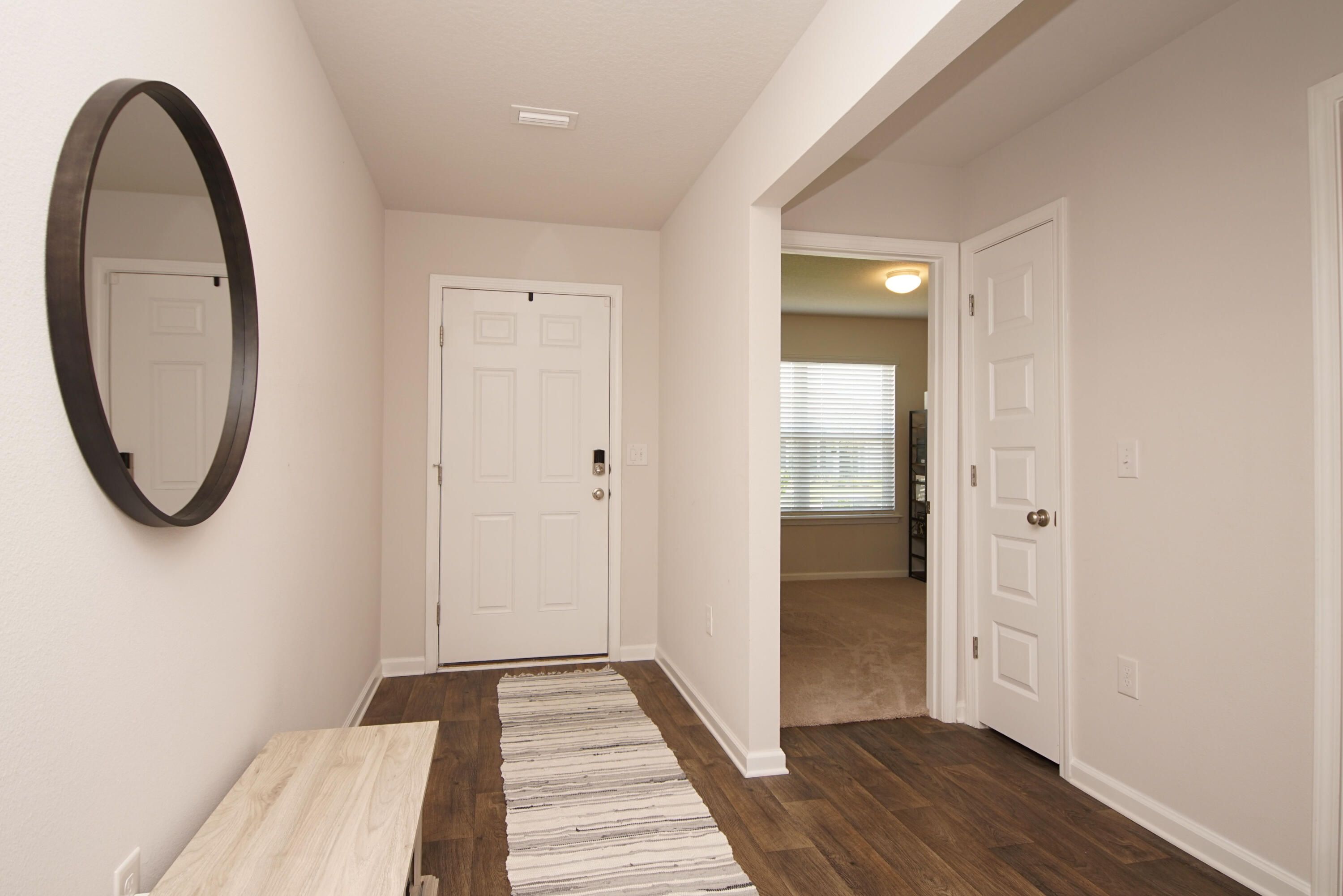 334 This Way Freeport, FL 32439 - Photo 7 of 55 a view of a room with wooden floor and white walls