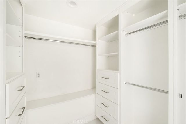 a bathroom with a shower and a glass door