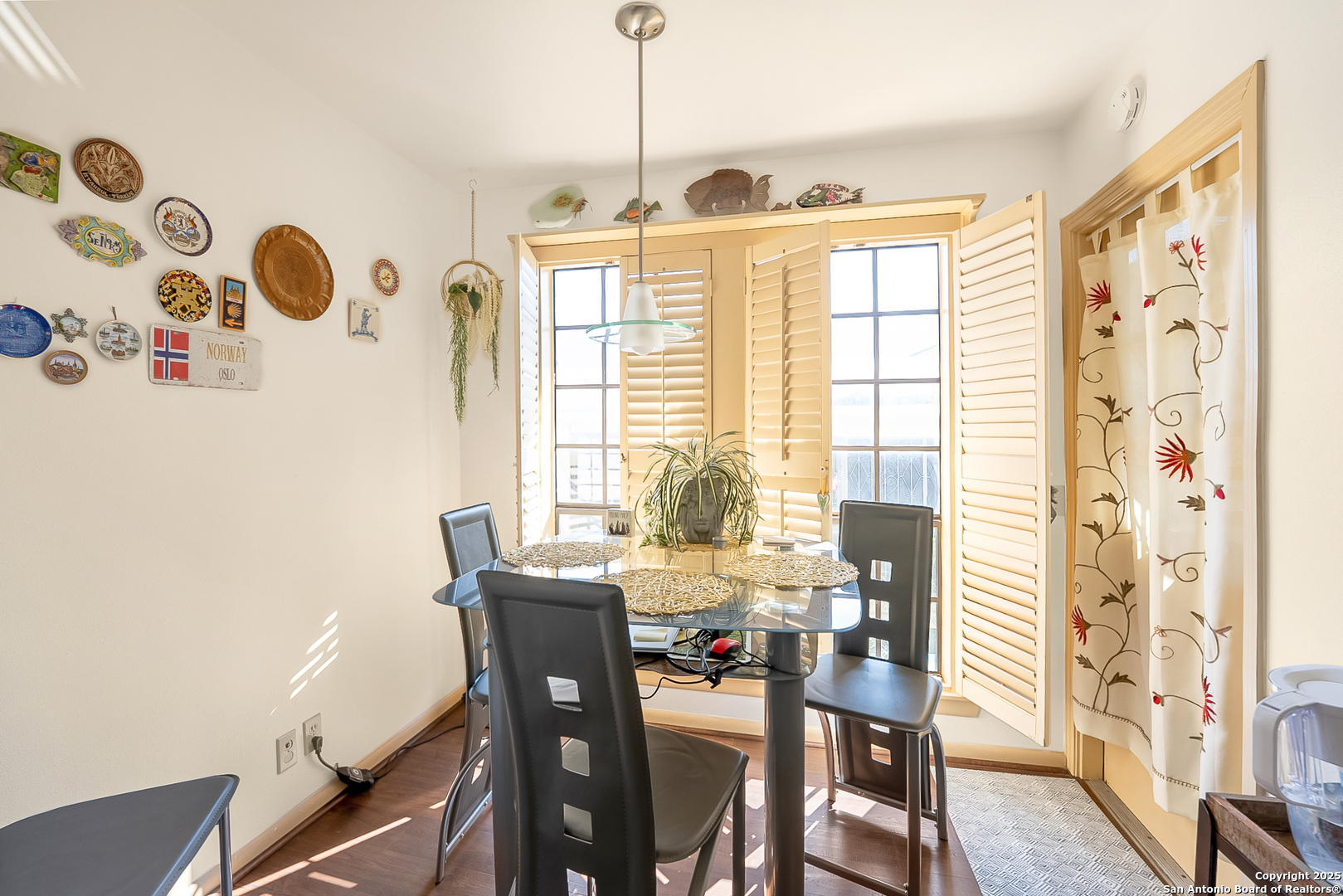 165 West Rampart Drive, Unit 706 San Antonio, TX 78216 - Photo 11 of 20 a view of a dining room with furniture and wooden floor