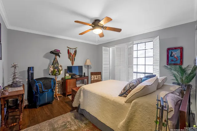 a bed room with a bed and a chandelier