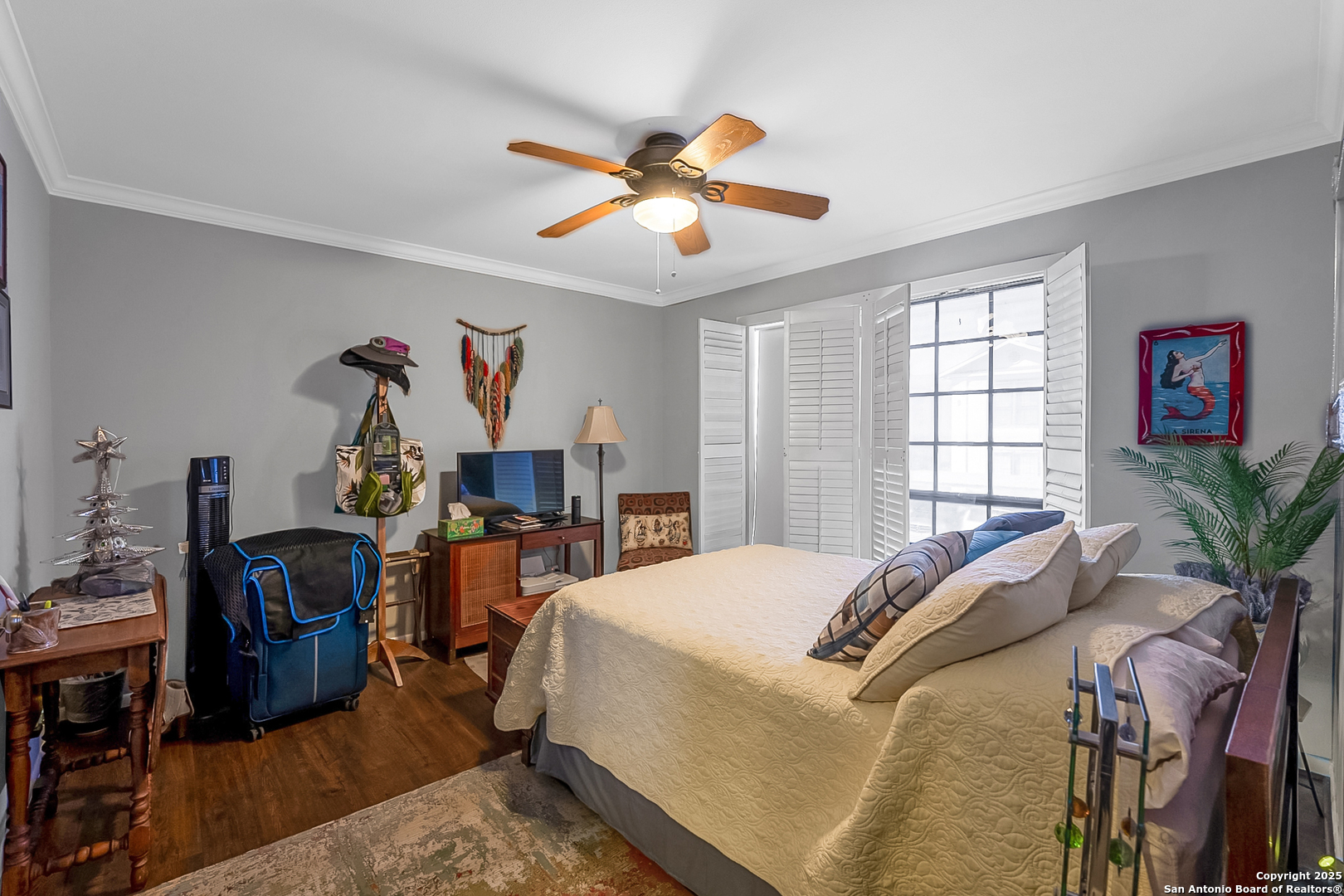 165 West Rampart Drive, Unit 706 San Antonio, TX 78216 - Photo 12 of 20 a bed room with a bed and a chandelier