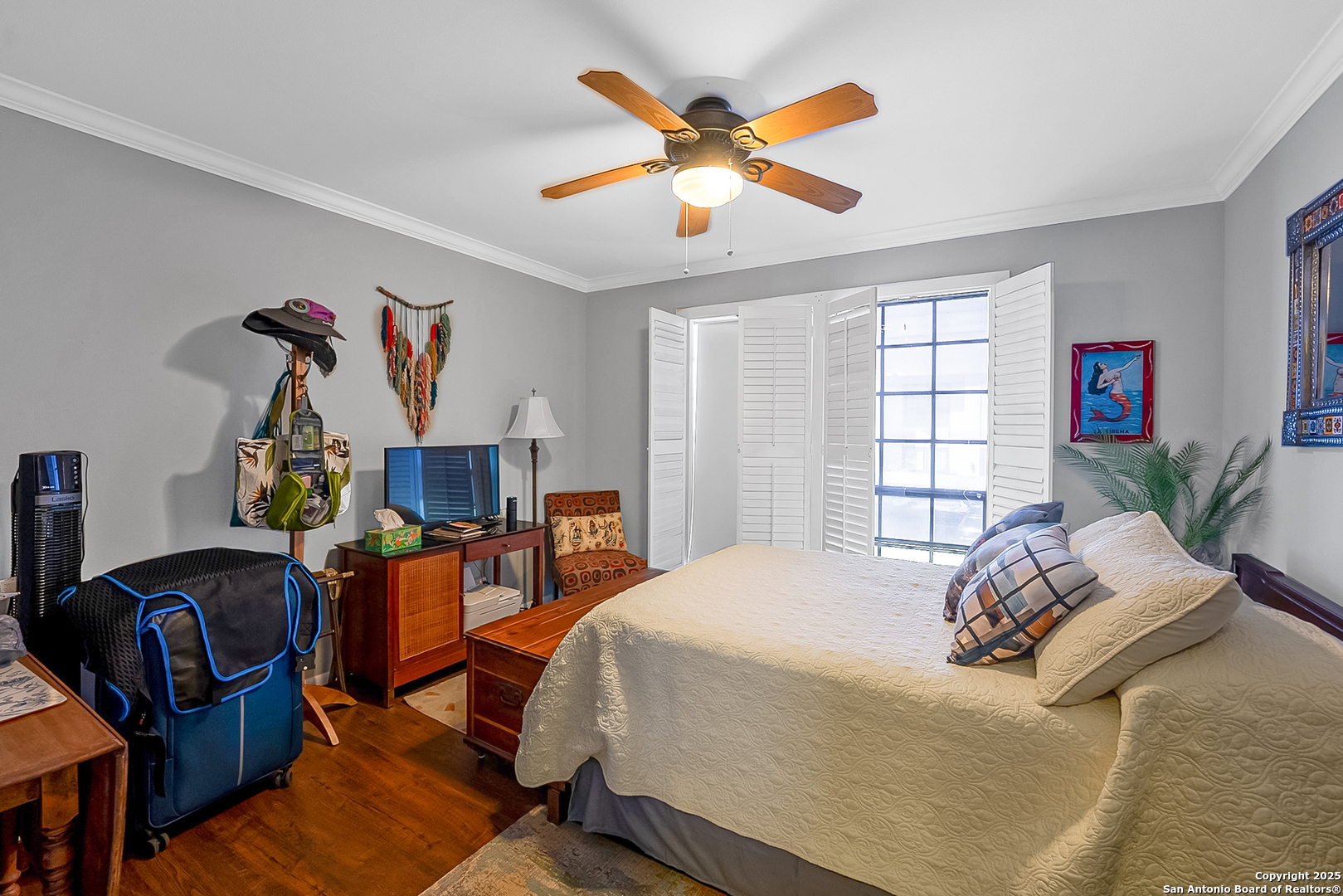165 West Rampart Drive, Unit 706 San Antonio, TX 78216 - Photo 13 of 20 a bedroom with a bed and dresser next to a window