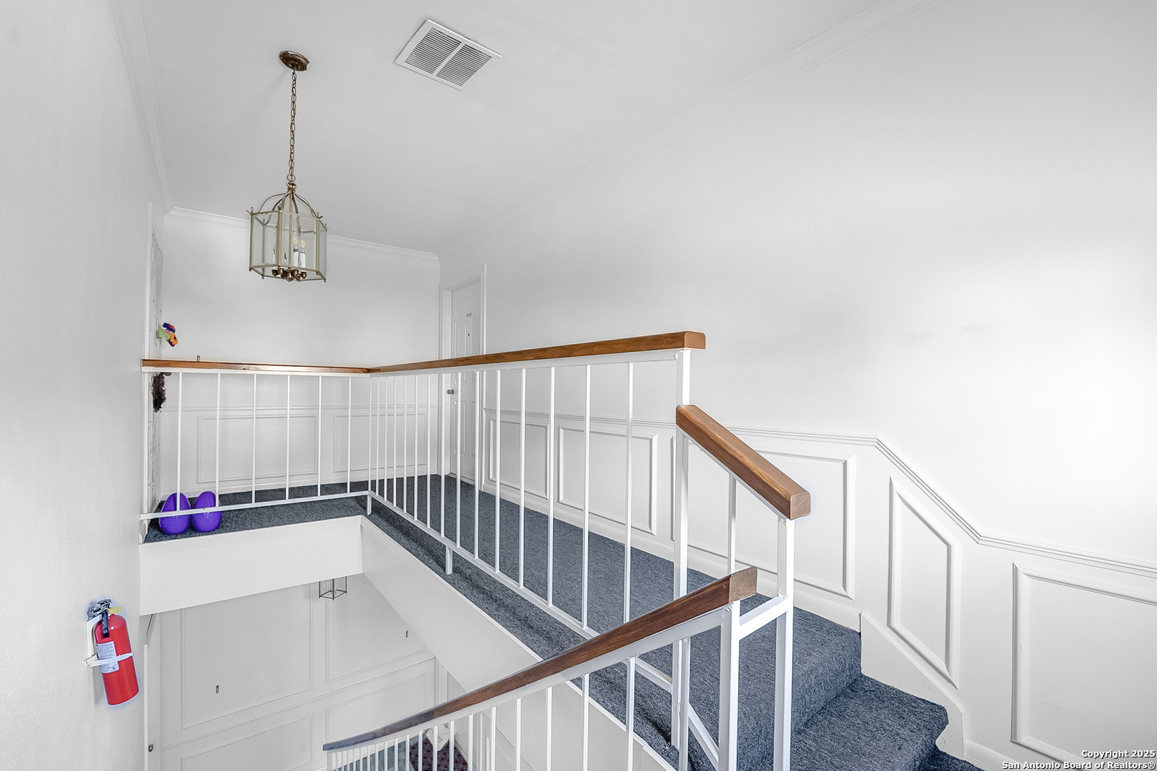 165 West Rampart Drive, Unit 706 San Antonio, TX 78216 - Photo 18 of 20 a view of room with stairs and wooden floor