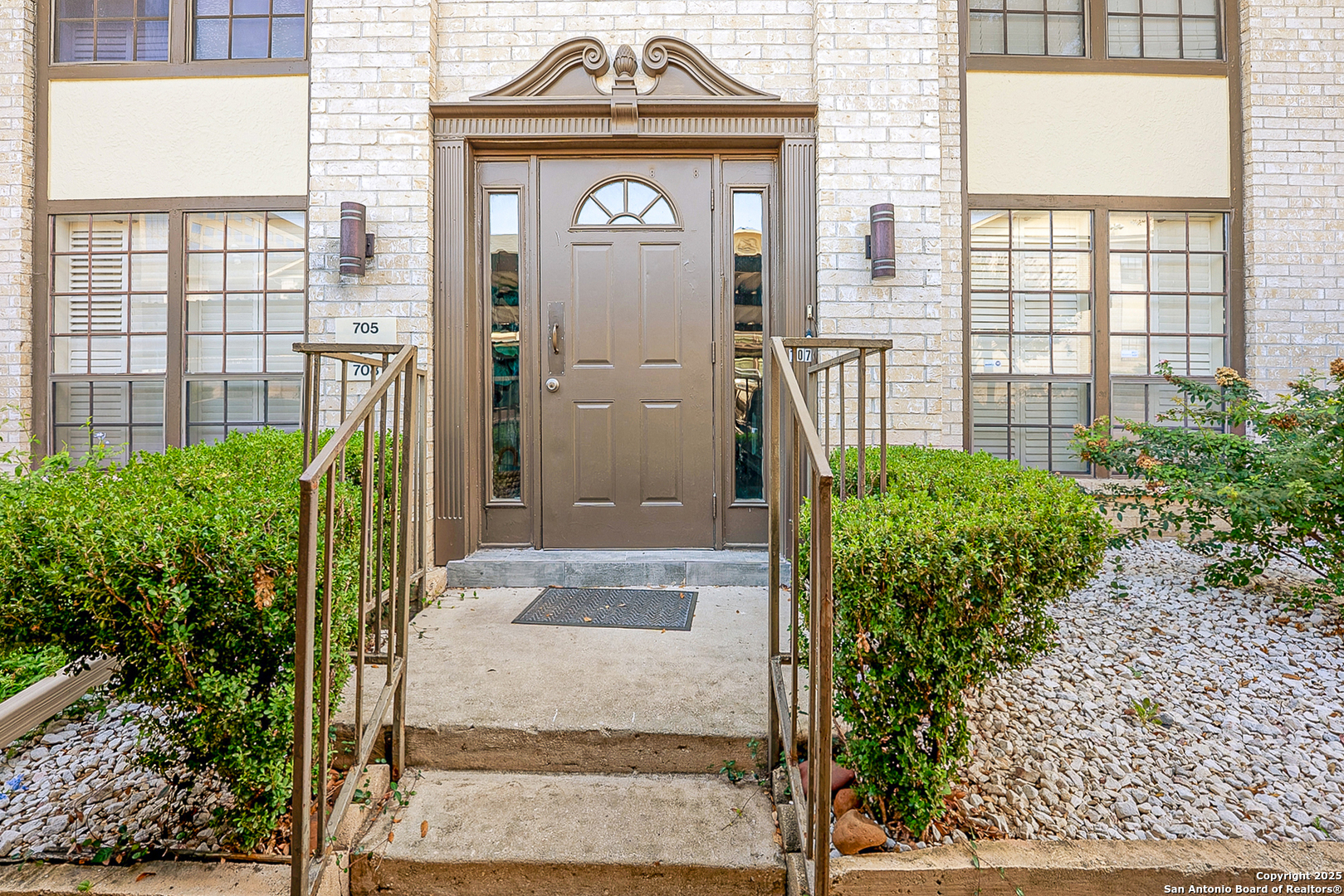 165 West Rampart Drive, Unit 706 San Antonio, TX 78216 - Photo 3 of 20 a view of a door with a potted plant and a window