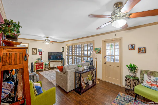 a living room with furniture fireplace and flat screen tv