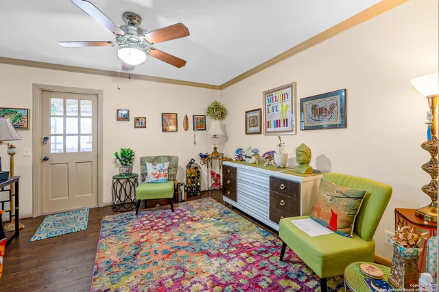 a living room with furniture and a rug