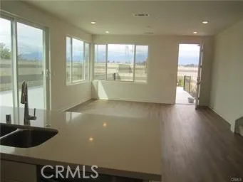 a view of a kitchen with a large window