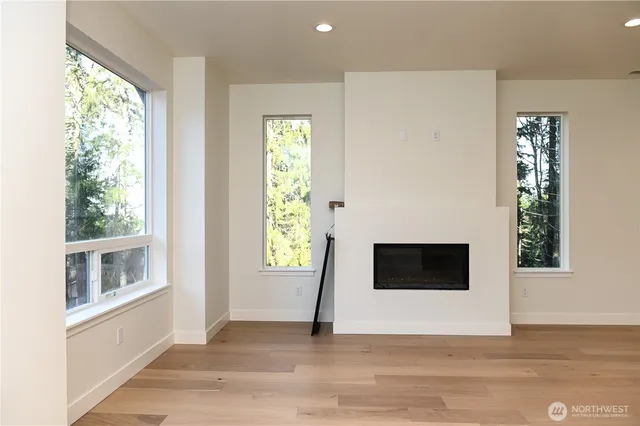 a living room with a fireplace and a window