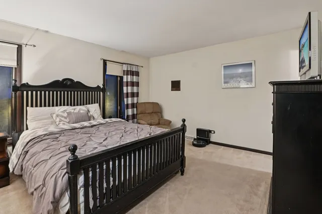 a bedroom with a bed and dresser