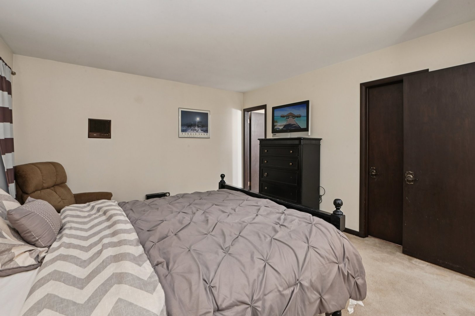 7605 Banks Street Justice, IL 60458 - Photo 15 of 47 a bedroom with a bed and a tv