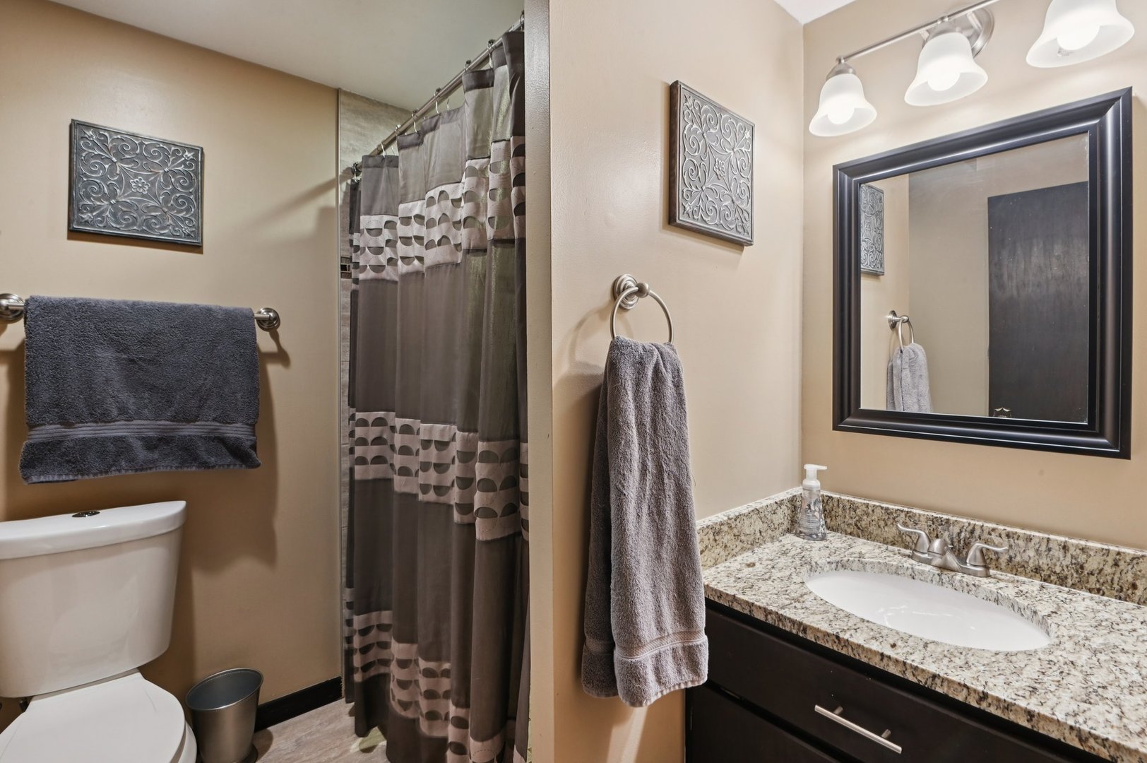 7605 Banks Street Justice, IL 60458 - Photo 17 of 47 a bathroom with a granite countertop sink toilet and shower