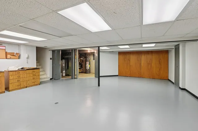 a view of an empty room with closet
