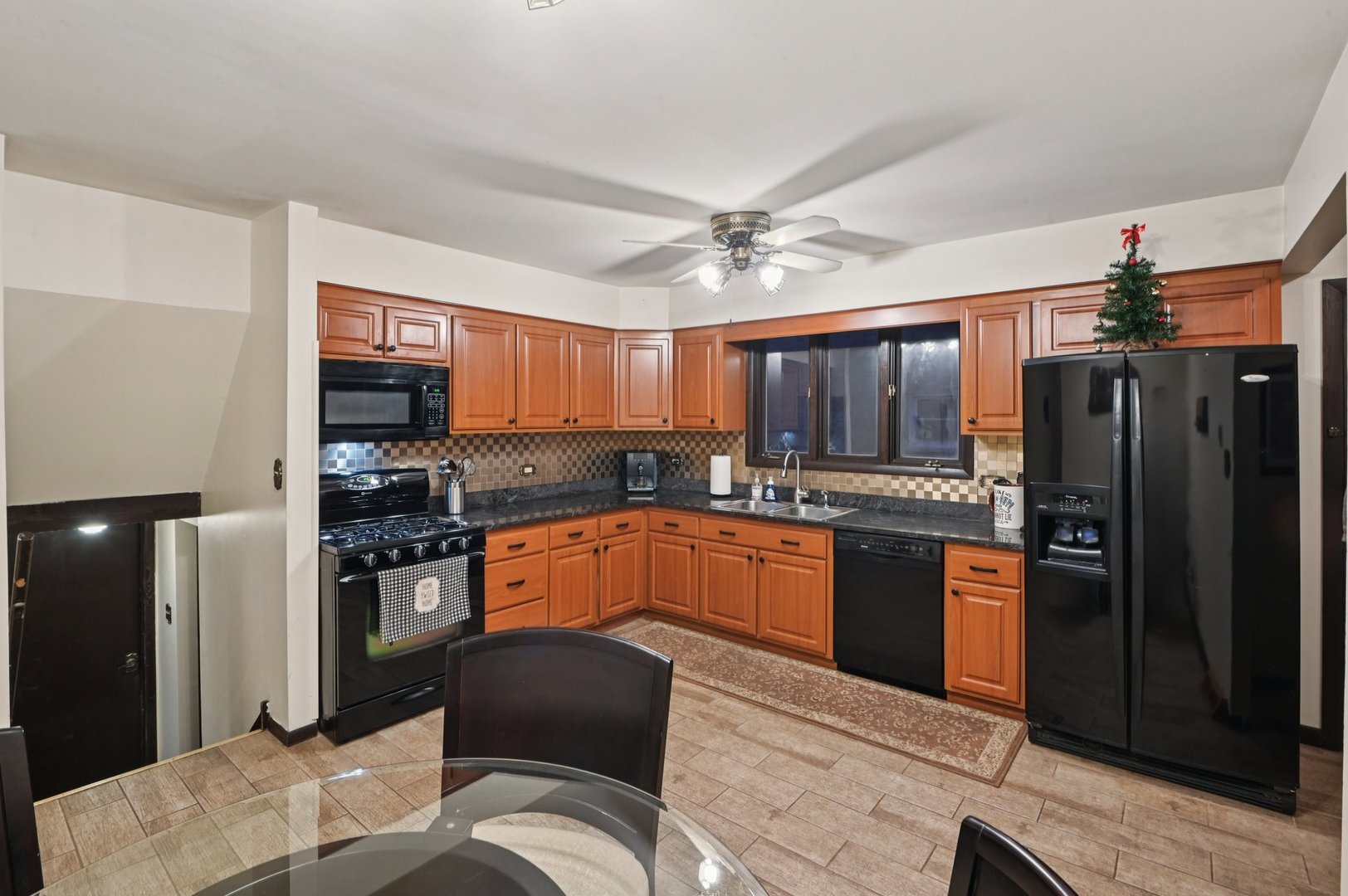 7605 Banks Street Justice, IL 60458 - Photo 9 of 47 a kitchen with stainless steel appliances granite countertop a refrigerator stove top oven and sink