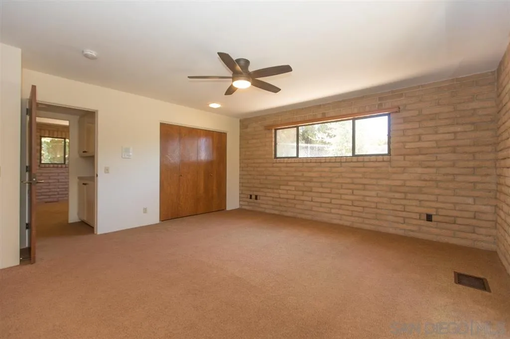 1211 Palomino Road Fallbrook, CA 92028 - Photo 19 of 25 a view of an empty room with a window