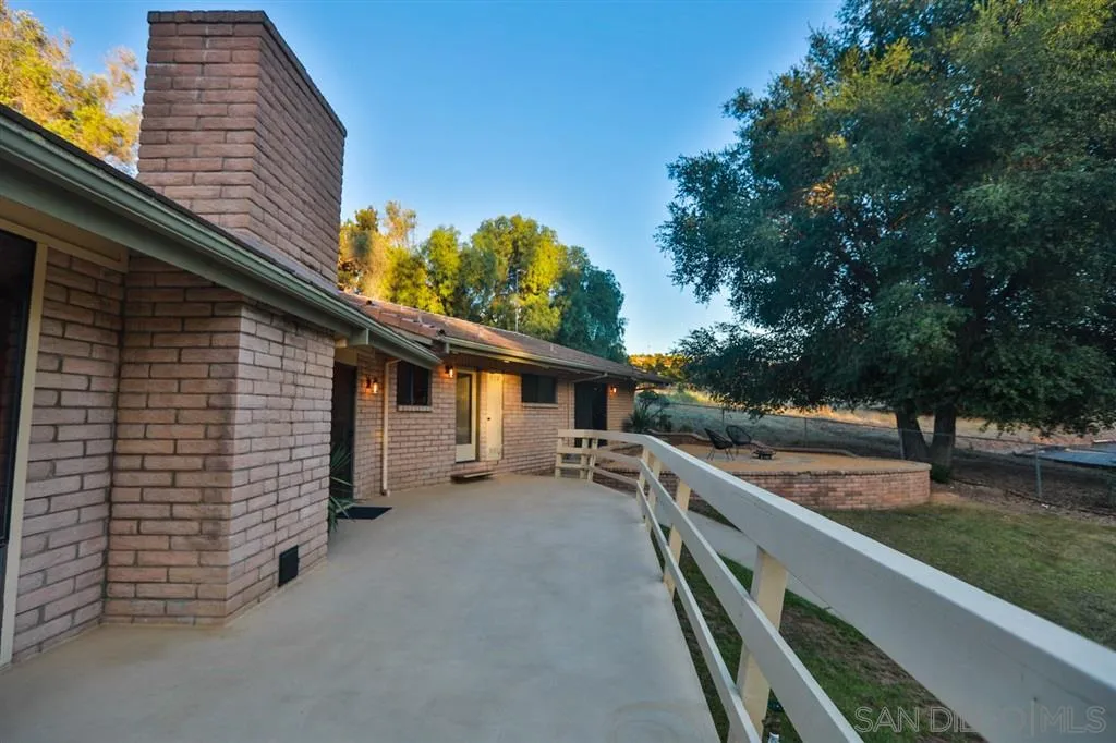 1211 Palomino Road Fallbrook, CA 92028 - Photo 23 of 25 a view of a house with a backyard
