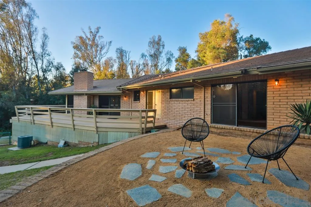 1211 Palomino Road Fallbrook, CA 92028 - Photo 24 of 25 a front view of a house with garden