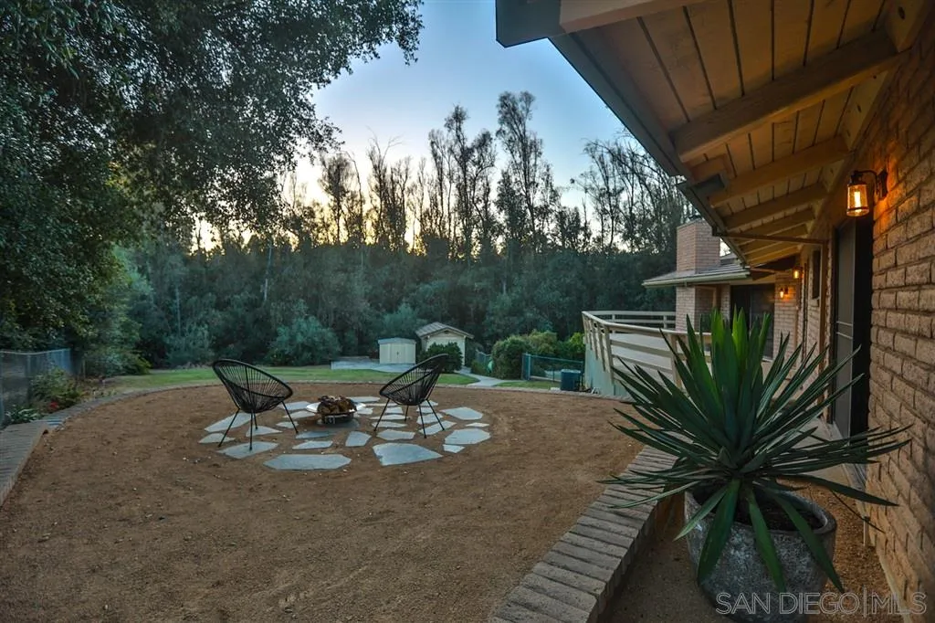 1211 Palomino Road Fallbrook, CA 92028 - Photo 25 of 25 a view of a backyard with sitting area