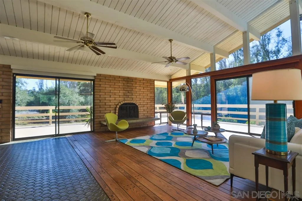1211 Palomino Road Fallbrook, CA 92028 - Photo 8 of 25 a living room with furniture and a fireplace