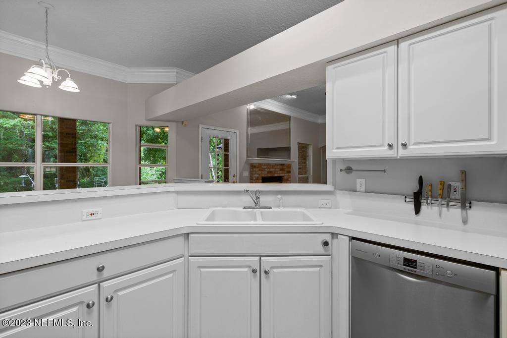 691 Nottingham Forest Circle St. Johns, FL 32259 - Photo 16 of 44 a kitchen with a sink and cabinets
