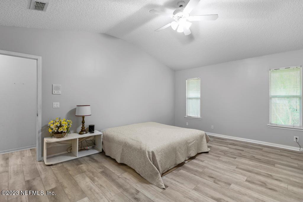691 Nottingham Forest Circle St. Johns, FL 32259 - Photo 19 of 44 a bedroom with a bed and a window