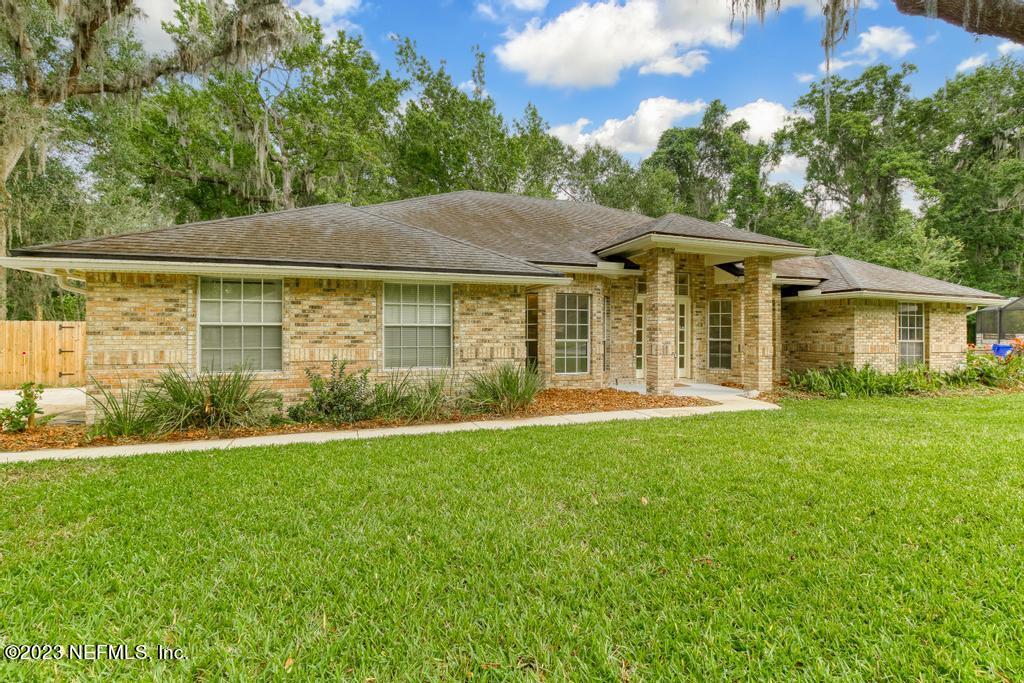 691 Nottingham Forest Circle St. Johns, FL 32259 - Photo 2 of 44 front view of a house with a yard