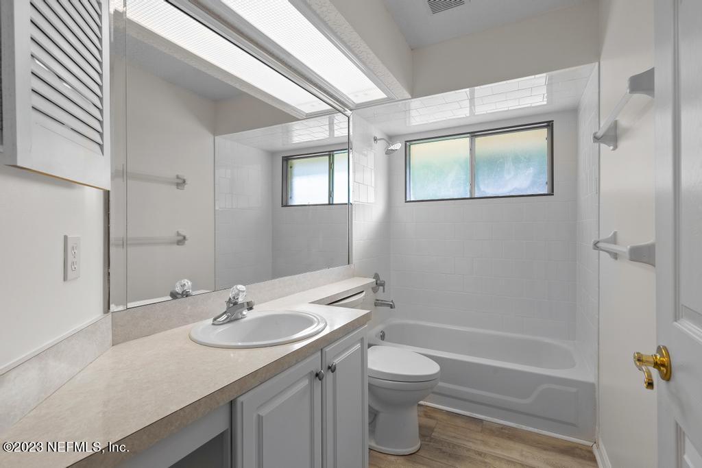 691 Nottingham Forest Circle St. Johns, FL 32259 - Photo 26 of 44 a bathroom with a granite countertop sink toilet and shower