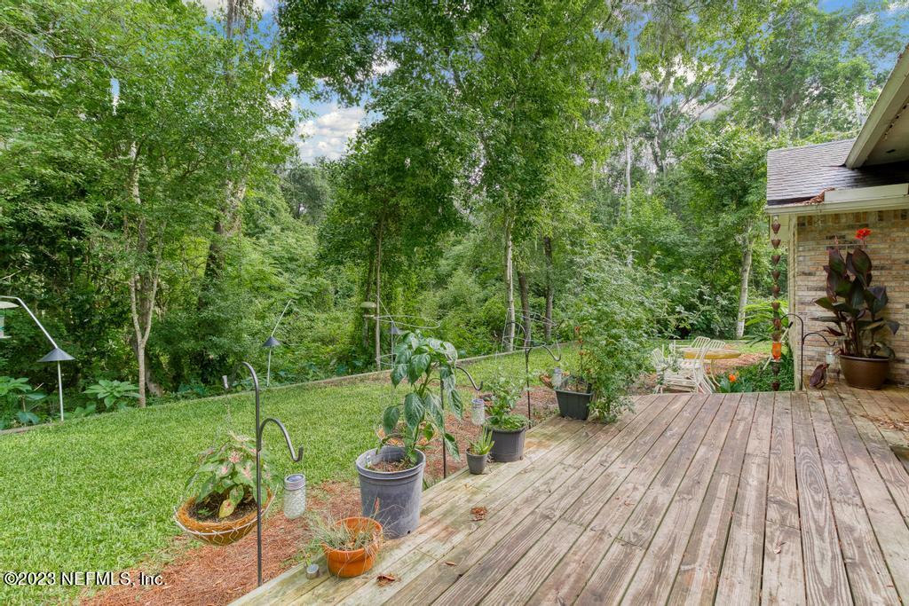 691 Nottingham Forest Circle St. Johns, FL 32259 - Photo 32 of 44 a view of a backyard with sitting area