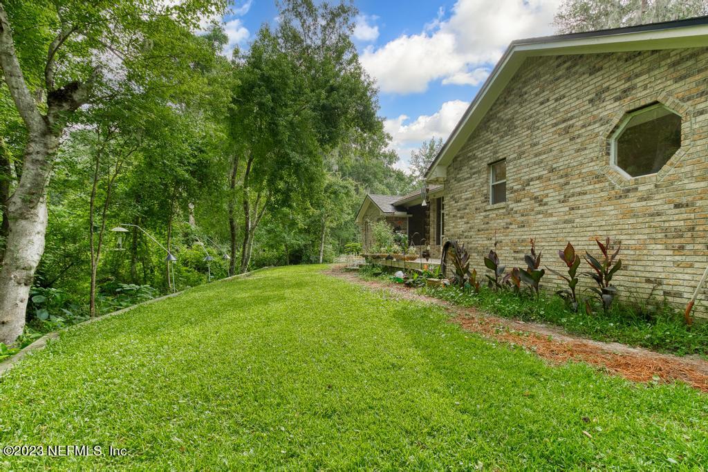 691 Nottingham Forest Circle St. Johns, FL 32259 - Photo 35 of 44 a backyard of a house with lots of green space