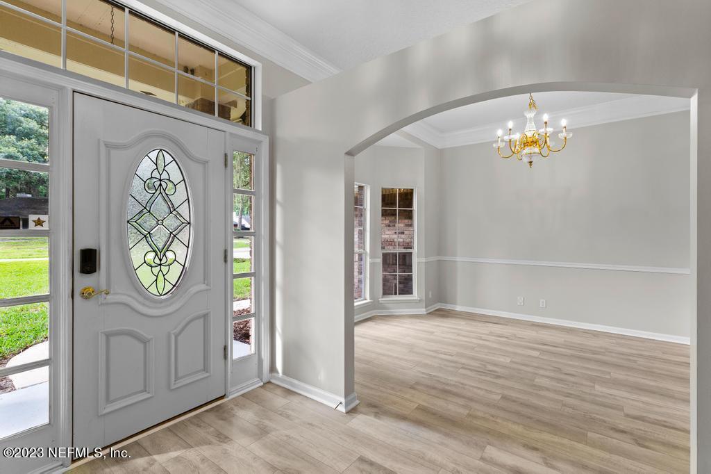 691 Nottingham Forest Circle St. Johns, FL 32259 - Photo 5 of 44 an entryway door with wooden floor