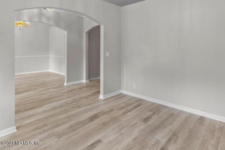 691 Nottingham Forest Circle St. Johns, FL 32259 - Photo 7 of 44 wooden floor in an empty room