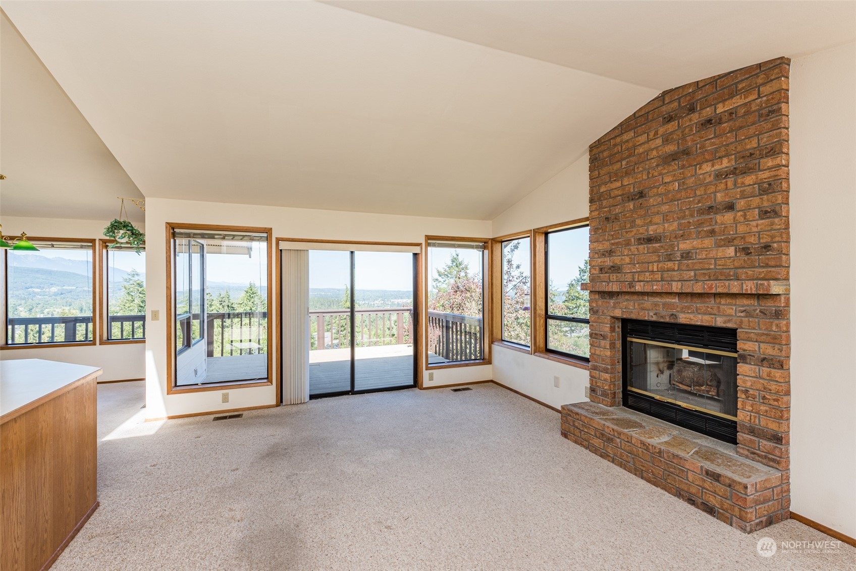 773 Ravens Ridge Road Sequim, WA 98382 - Photo 12 of 38 a view of an empty room with a fireplace