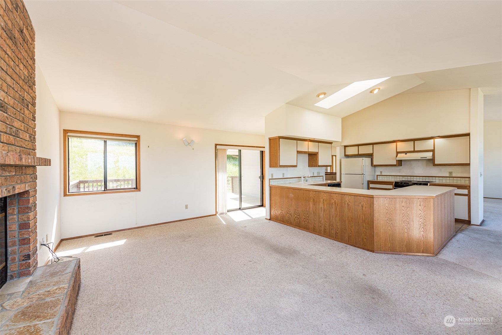 773 Ravens Ridge Road Sequim, WA 98382 - Photo 14 of 38 a view of kitchen with kitchen island sink and refrigerator