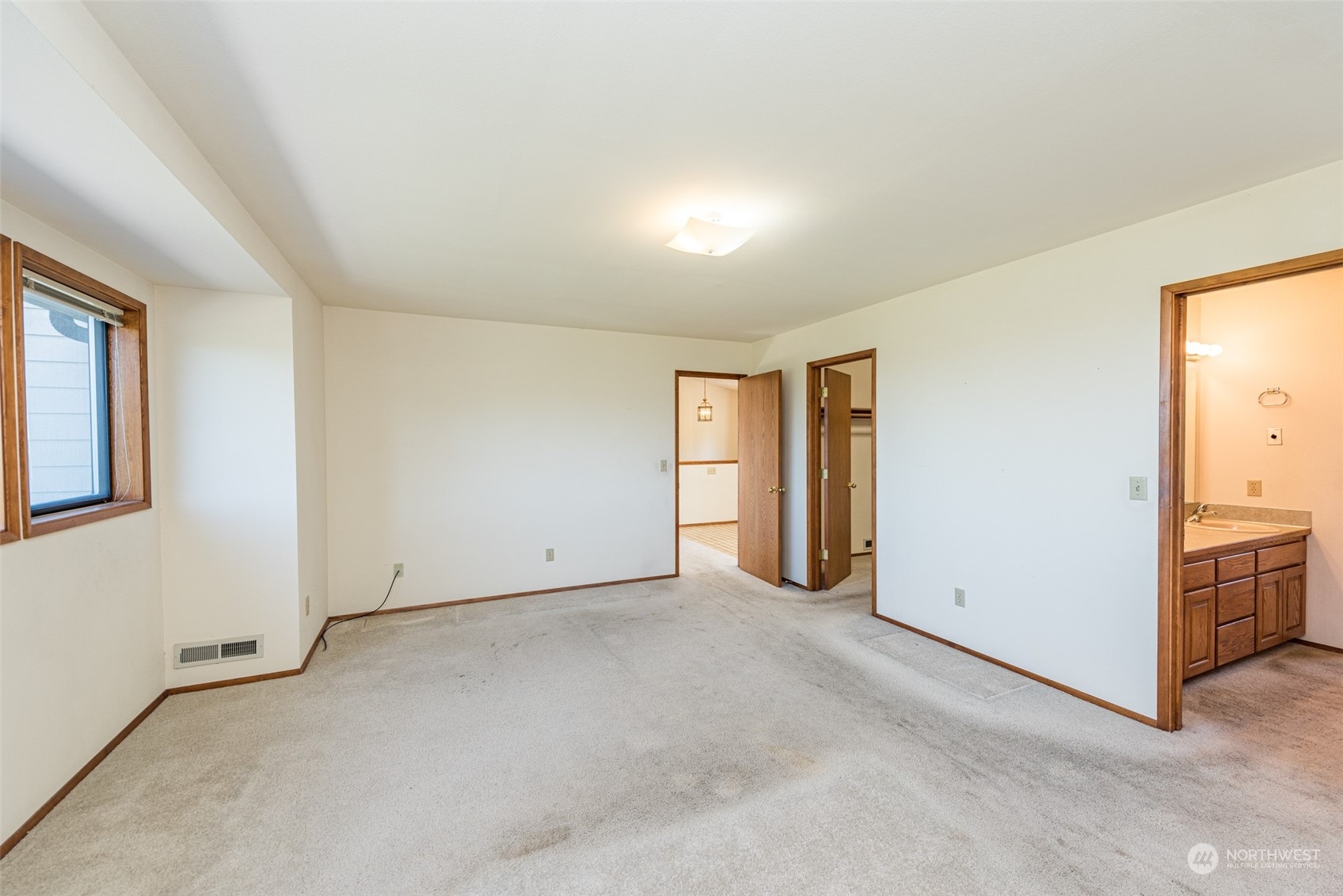 773 Ravens Ridge Road Sequim, WA 98382 - Photo 22 of 38 an empty room with windows