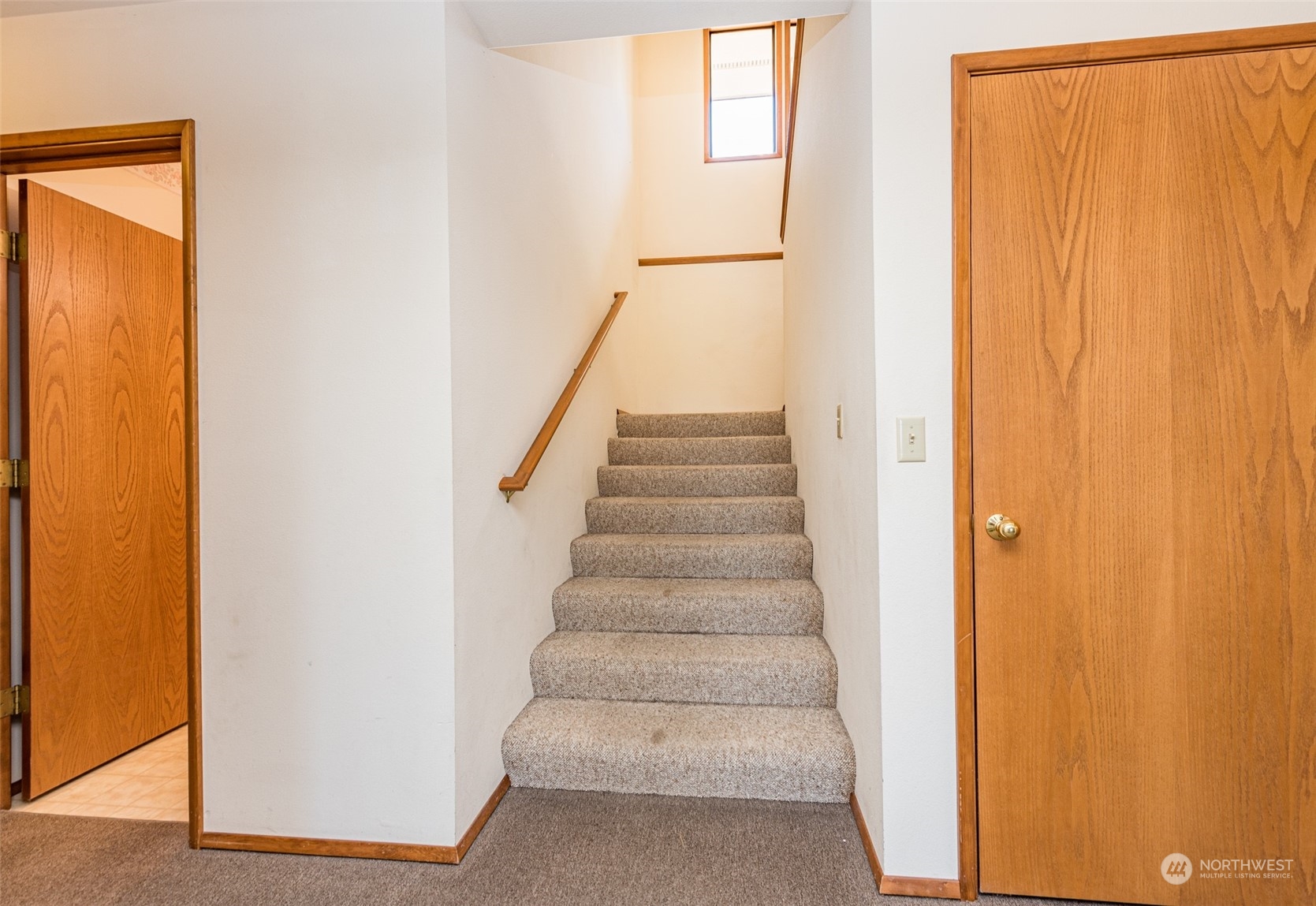 773 Ravens Ridge Road Sequim, WA 98382 - Photo 26 of 38 a view of staircase with white walls and a window