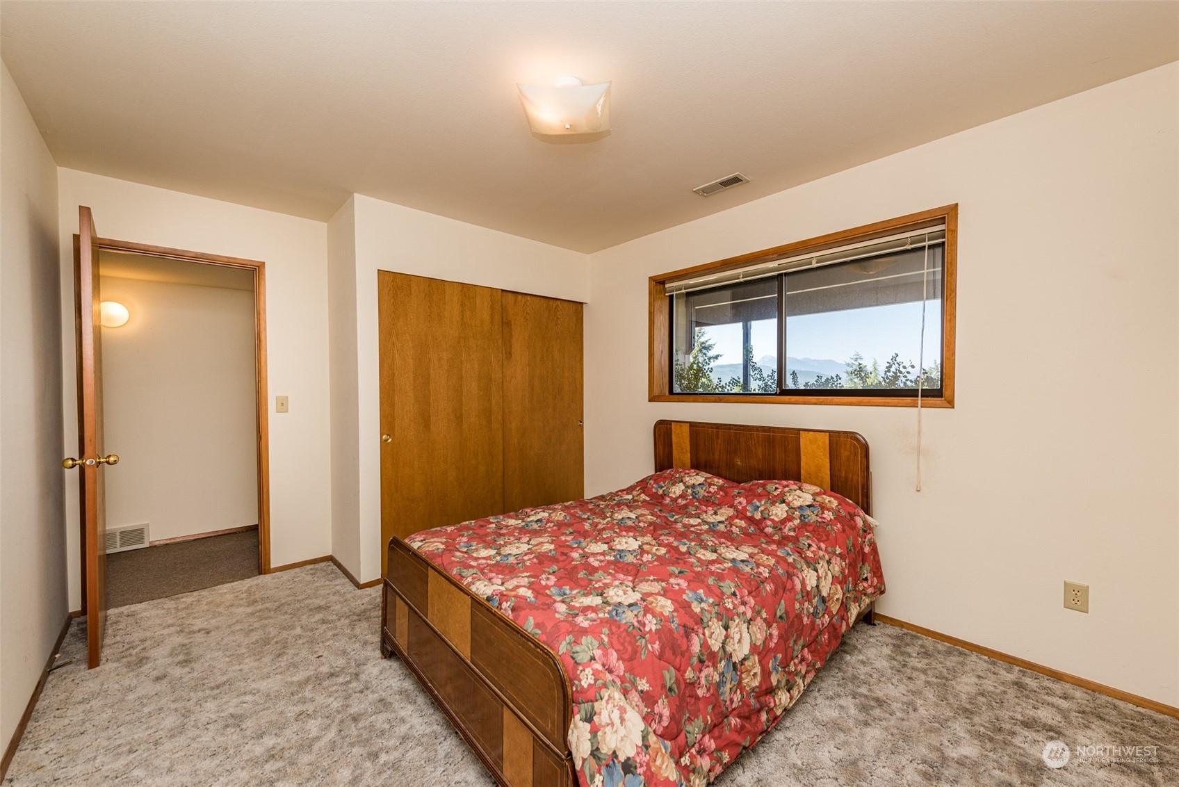 773 Ravens Ridge Road Sequim, WA 98382 - Photo 29 of 38 a bedroom with a bed and a window