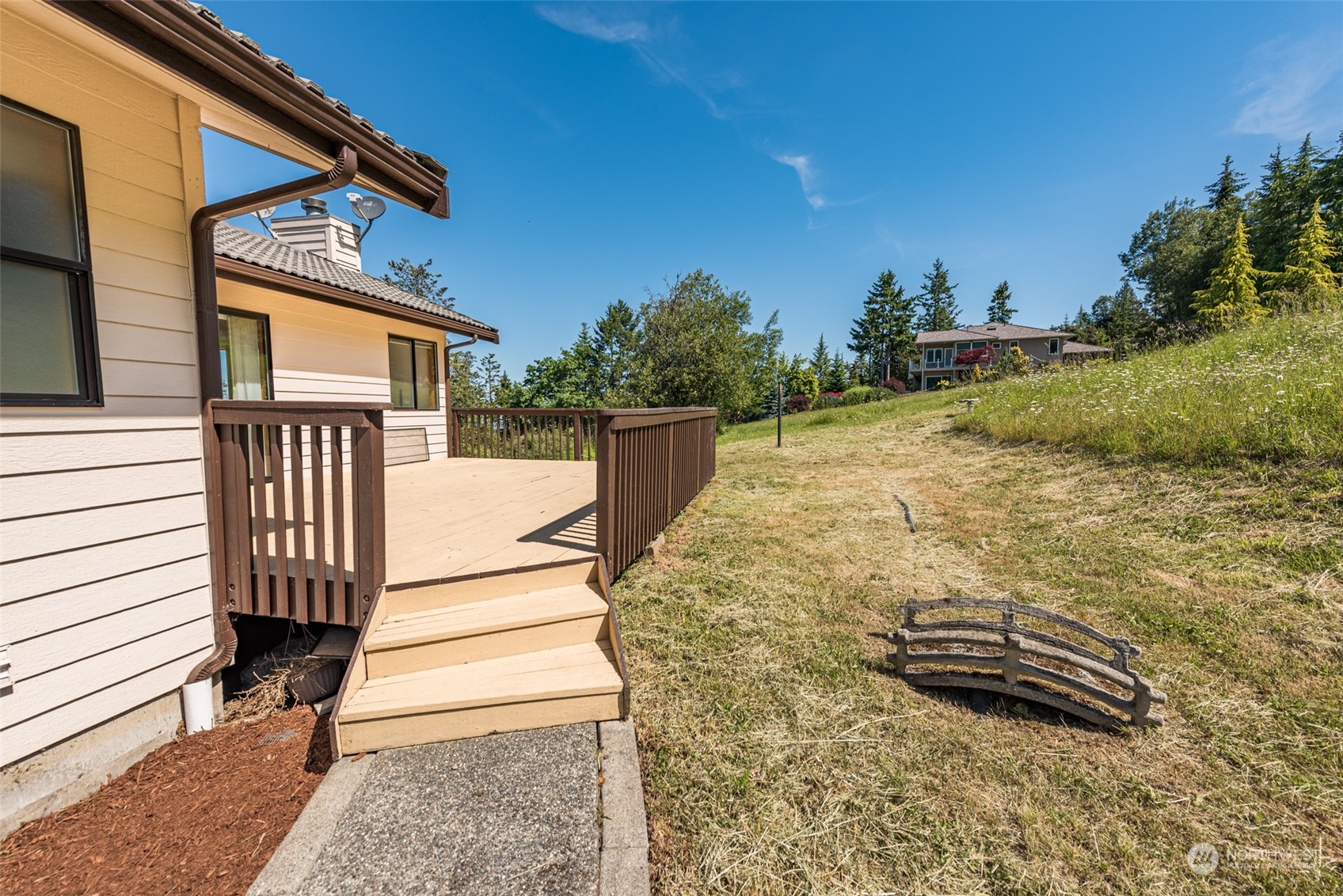 773 Ravens Ridge Road Sequim, WA 98382 - Photo 34 of 38 a view of a backyard with wooden fence