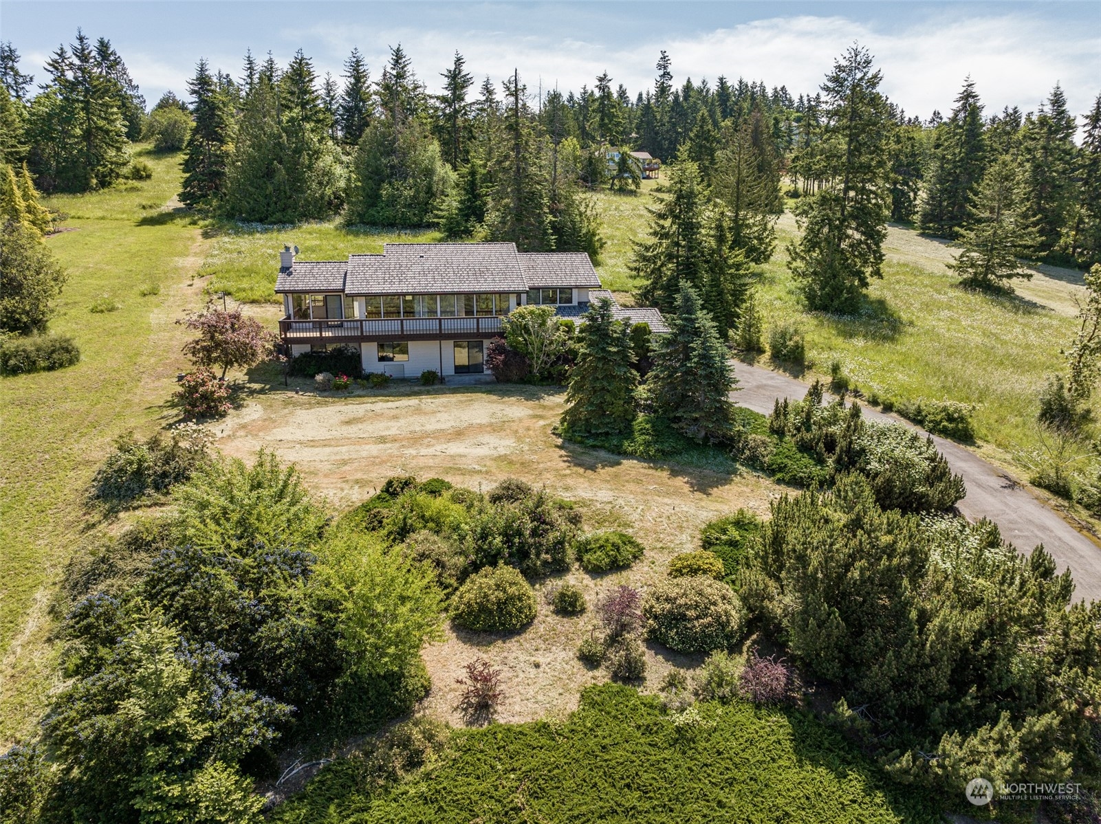 773 Ravens Ridge Road Sequim, WA 98382 - Photo 37 of 38 a view of a house with a yard and lake view