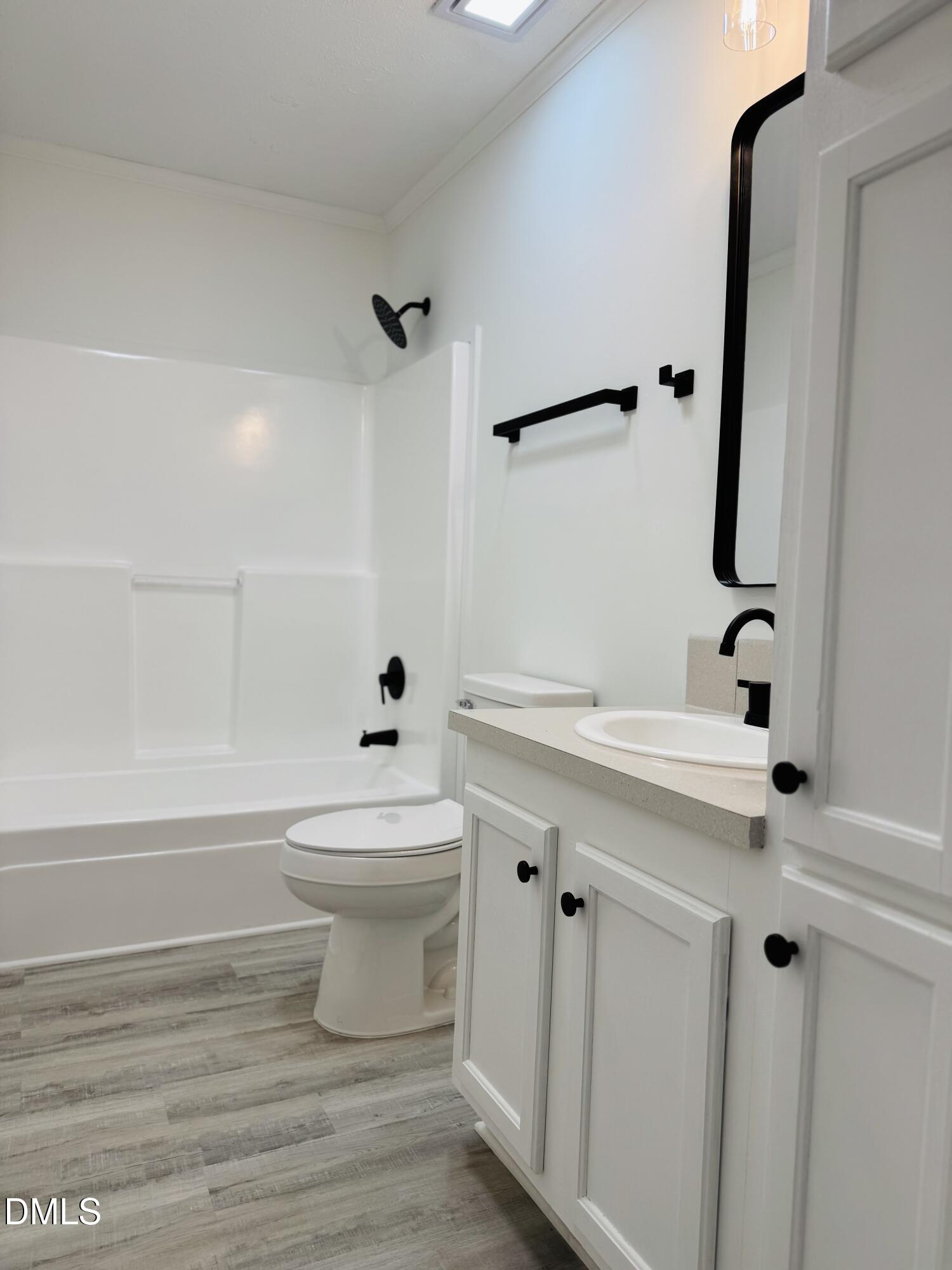 73 Christys Way Roxboro, NC 27574 - Photo 11 of 13 a bathroom with a sink a toilet and shower