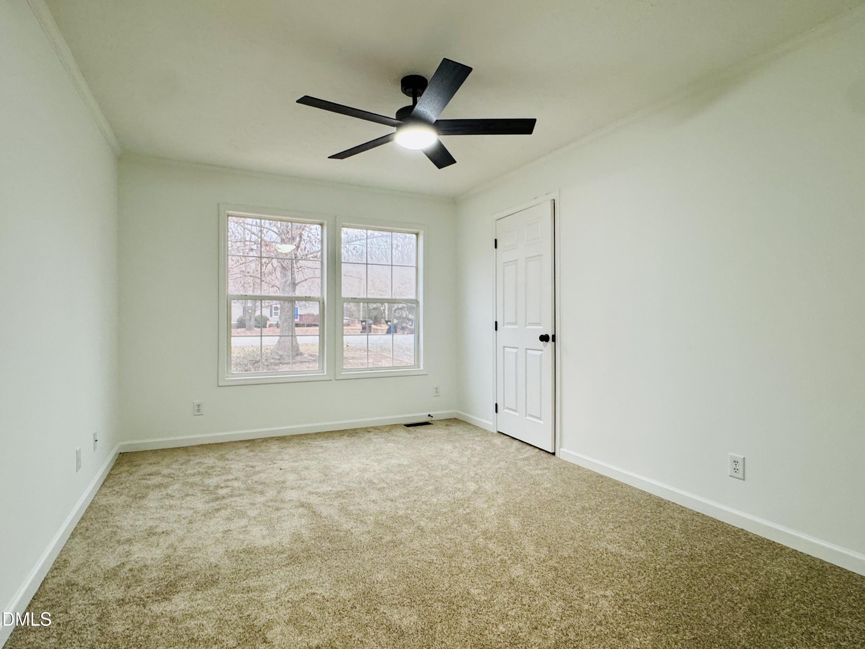 73 Christys Way Roxboro, NC 27574 - Photo 13 of 13 an empty room with ceiling fan and windows