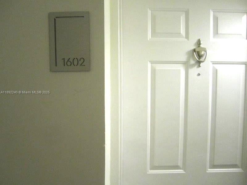 540 Brickell Key Drive, Unit 1602 Miami, FL 33131 - Photo 11 of 61 a door with a sign on it