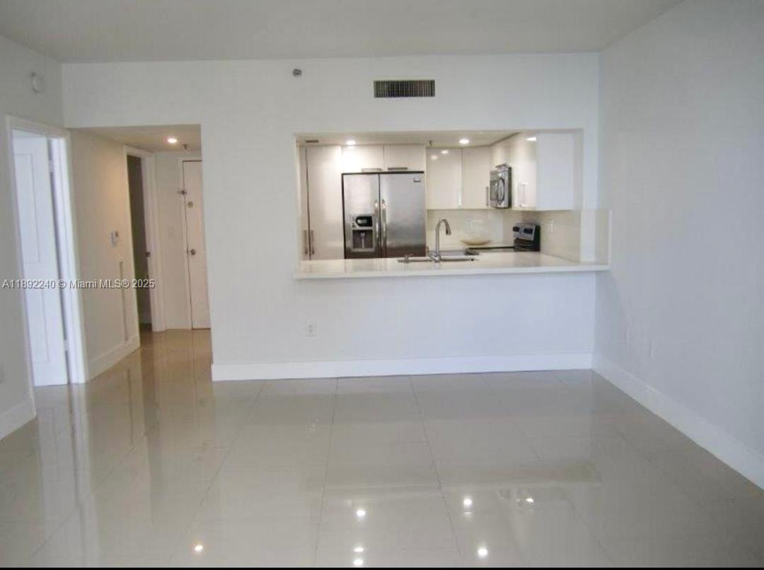 540 Brickell Key Drive, Unit 1602 Miami, FL 33131 - Photo 22 of 61 Living room overlooking kitchen.