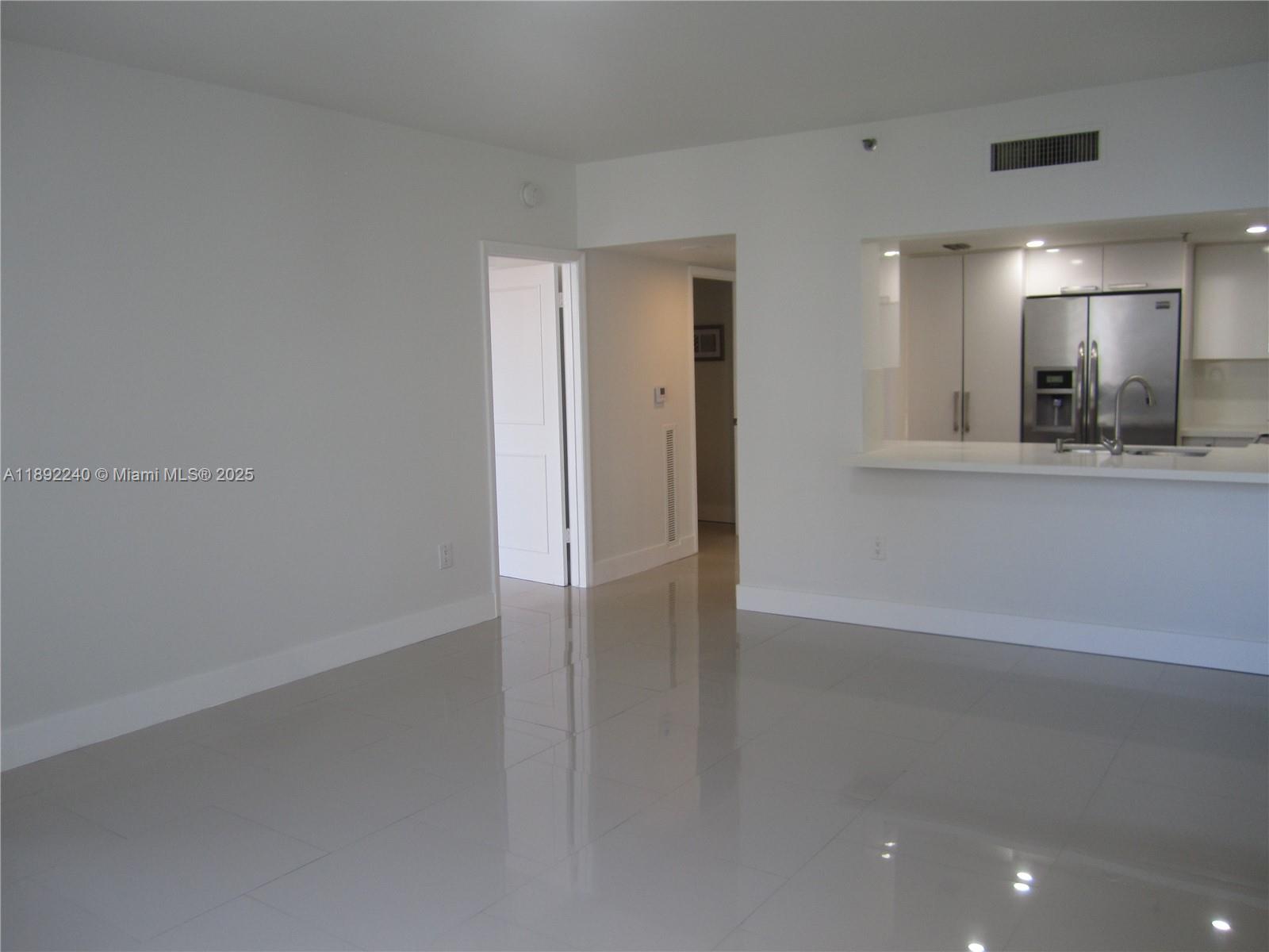 540 Brickell Key Drive, Unit 1602 Miami, FL 33131 - Photo 24 of 61 Living room overlooking living and bedroom door.