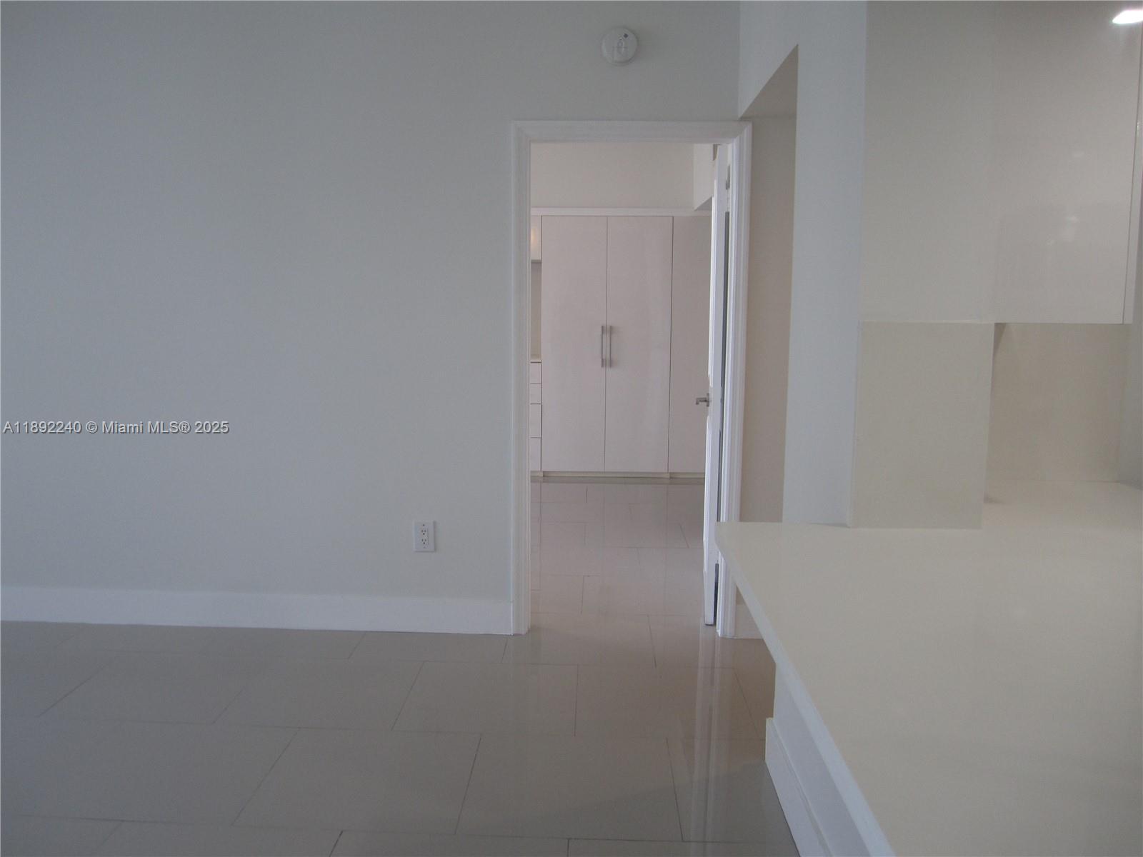 540 Brickell Key Drive, Unit 1602 Miami, FL 33131 - Photo 25 of 61 Living room looking into bedroom.