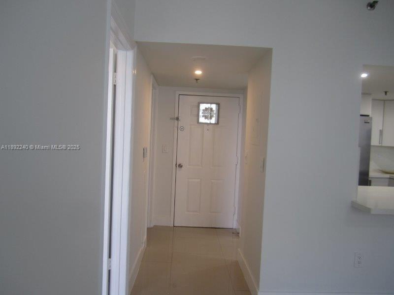 540 Brickell Key Drive, Unit 1602 Miami, FL 33131 - Photo 26 of 61 Looking from the living room to the front door.