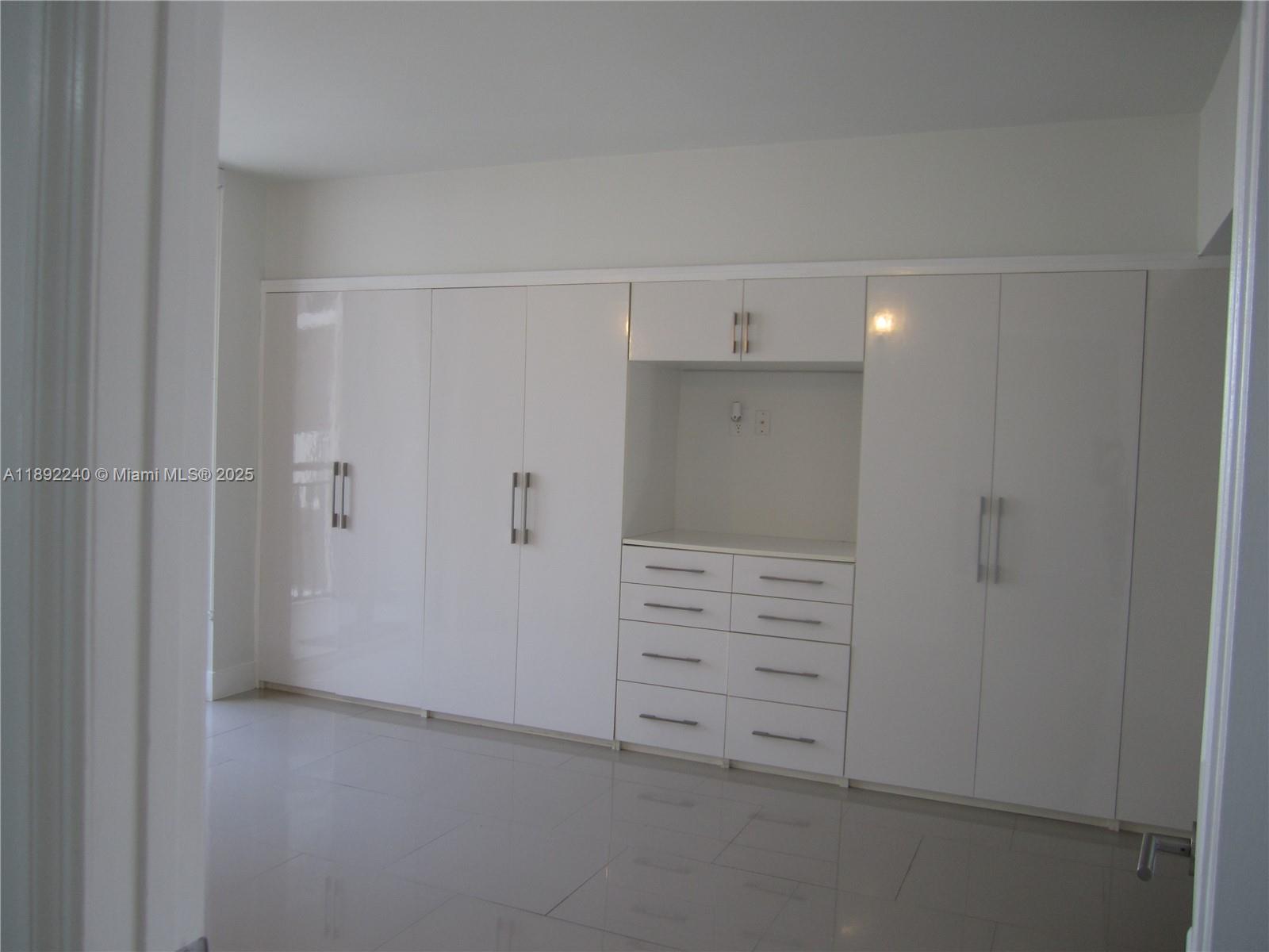 540 Brickell Key Drive, Unit 1602 Miami, FL 33131 - Photo 28 of 61 Custom built wood closet