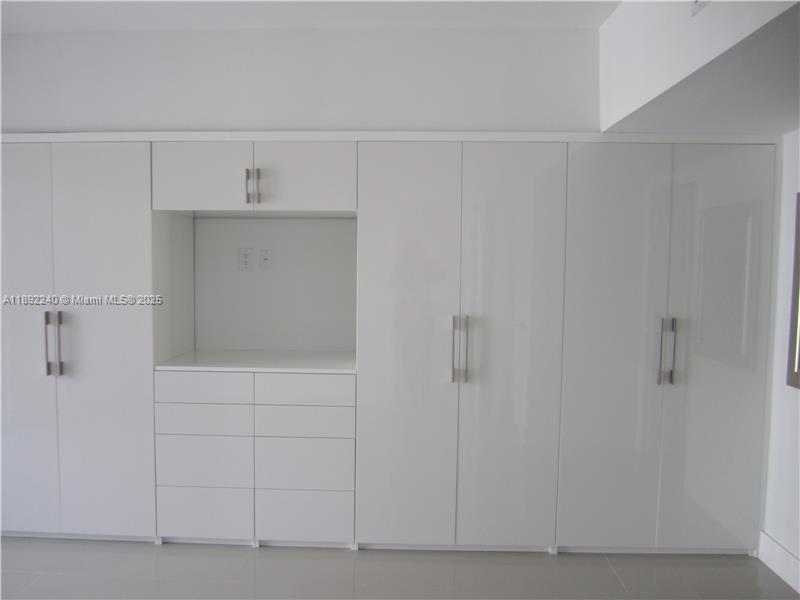 540 Brickell Key Drive, Unit 1602 Miami, FL 33131 - Photo 29 of 61 Bedroom and closet.