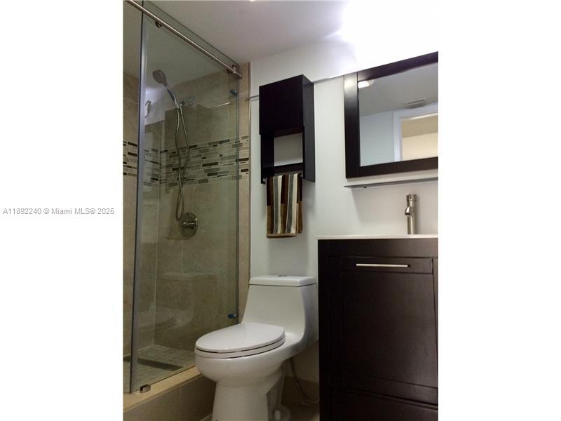 540 Brickell Key Drive, Unit 1602 Miami, FL 33131 - Photo 31 of 61 Master Bath, glass doors with shower.