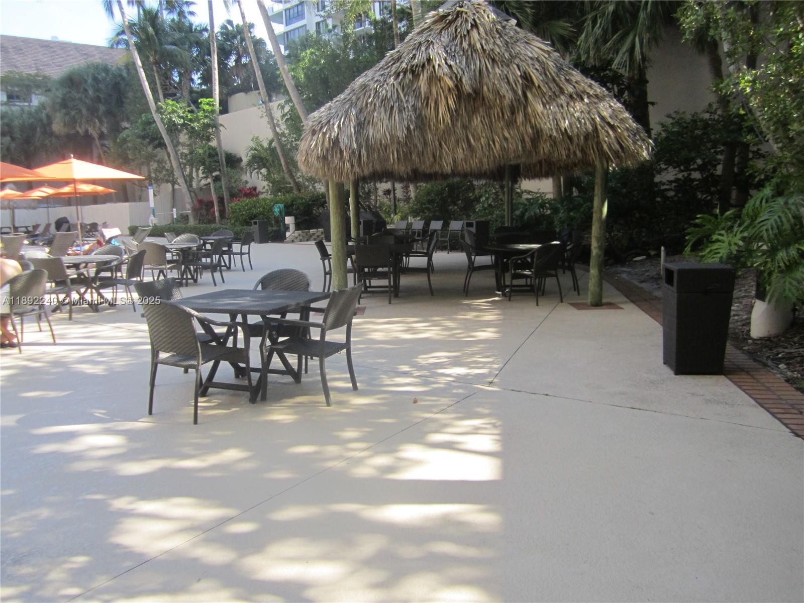 540 Brickell Key Drive, Unit 1602 Miami, FL 33131 - Photo 52 of 61 Tiki Bar by the pool.